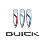 Close-up of Buick car emblems, auto repair shop background.