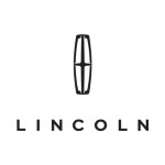Auto repair shop with a Lincoln vehicle in front of the shop.
